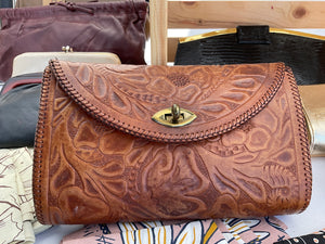 Vintage tooled leather clutch